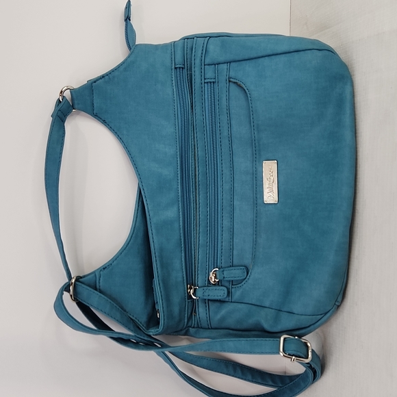 Multi Sac Handbags - Multisac vegan blue crossbody bag. Size 10 X 9".